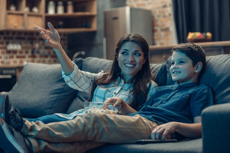 woman and child watching tv together