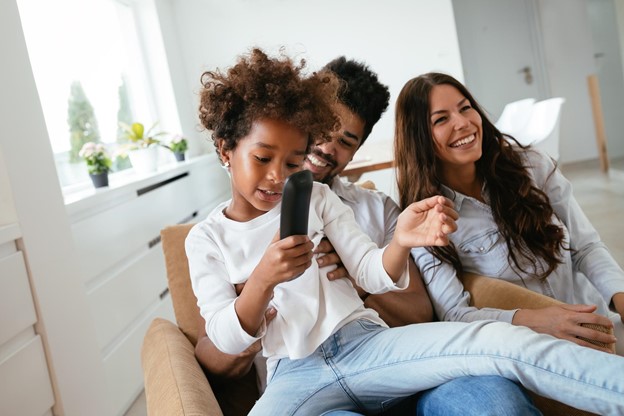 Family together preparing to watch TV